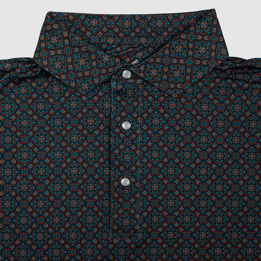 Flat lay of the Pearl Snap Polo by Iron Oak Apparel, showcasing its intricate western pattern and signature pearl snap buttons. This stylish shirt blends modern design with Texan authenticity, perfect for elevating any casual wardrobe.