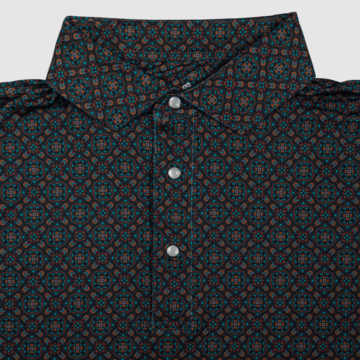 Flat lay of the Pearl Snap Polo by Iron Oak Apparel, showcasing its intricate western pattern and signature pearl snap buttons. This stylish shirt blends modern design with Texan authenticity, perfect for elevating any casual wardrobe.