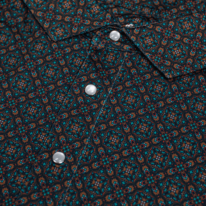Close-up of the Pearl Snap Polo by Iron Oak Apparel, showcasing its intricate geometric pattern and signature pearl snap buttons. This stylish shirt combines modern design with Texan authenticity, perfect for elevating casual outfits.
