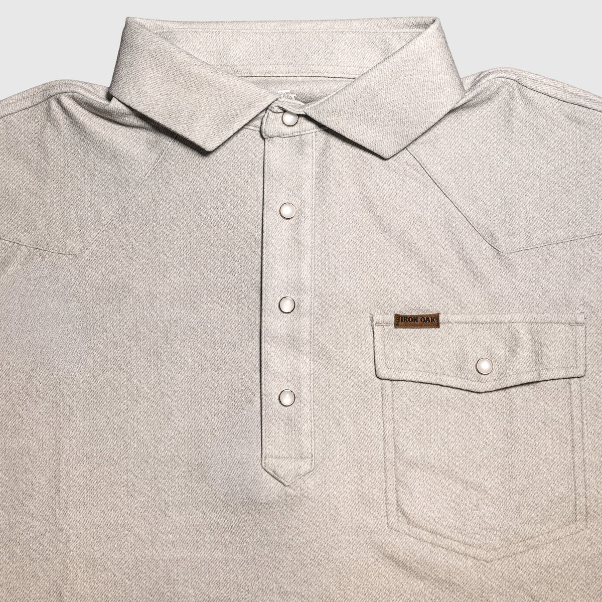 The Otis pearl-snap polo by Iron Oak