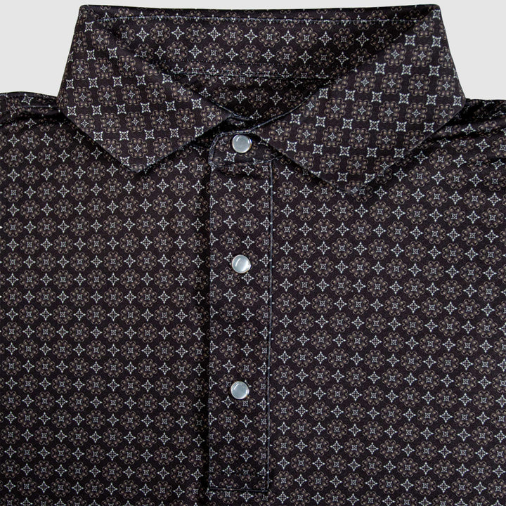 Flat lay of The Bandit Pearl Snap Polo by Iron Oak Apparel, featuring a refined western pattern in shades of brown and black, along with the brand's signature pearl snap buttons. This elegant shirt combines modern design with Texan authenticity, perfect for any stylish casual outfit.