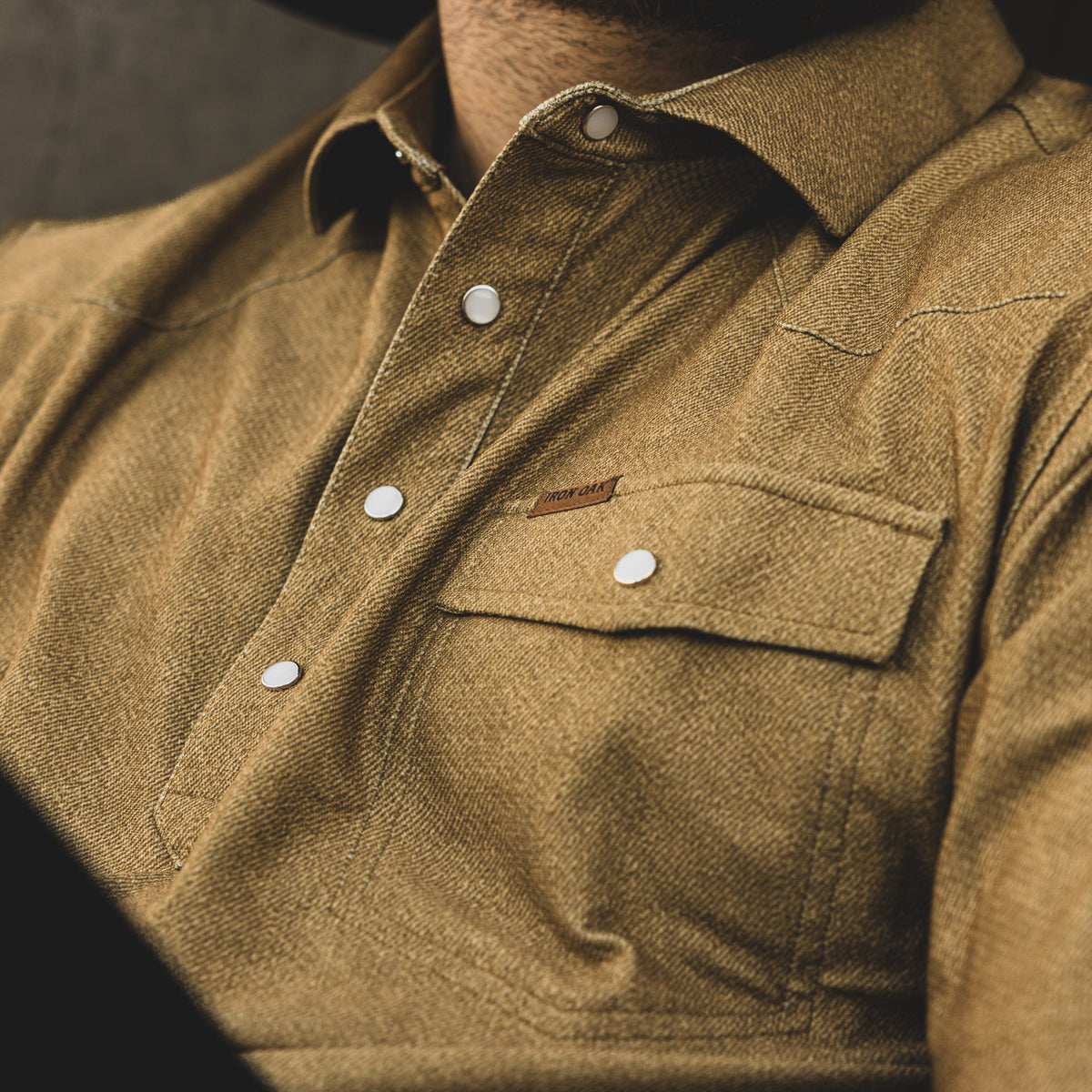 The Dusty's pearl snaps, structured collar, chest pocket and western yoke stitching